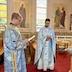 Justin Scott and Fr. Aleksey appear as in the previous photo except that Fr. Aleksey is now facing the camera.
